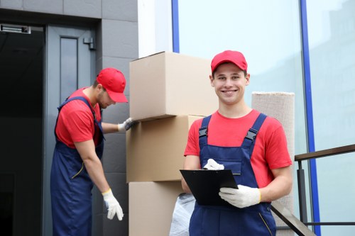 Belvedere movers handling furniture in a residential street