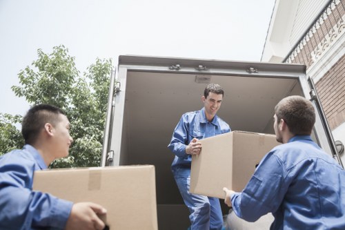 Packed office boxes and furniture ready for transport
