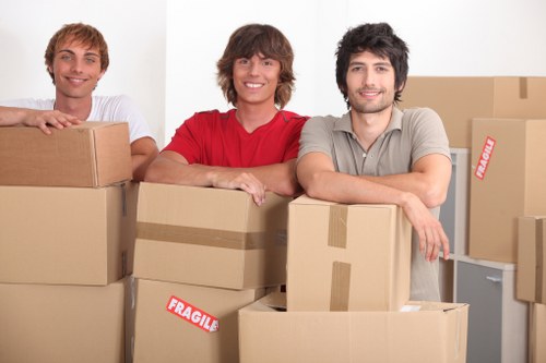 Packed moving boxes and household items ready for collection