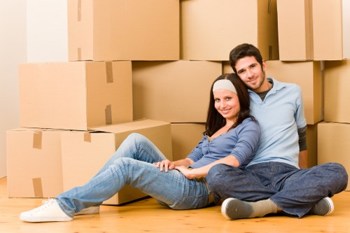 Professional moving team handling boxes and furniture