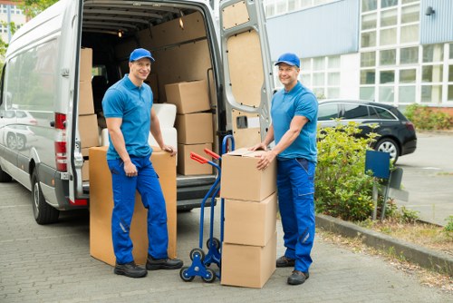 Team unloading household items during a house removal in Belvedere